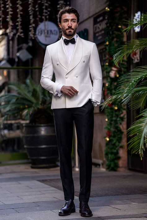 Flaunt your luxurious charm with the White Slim-Fit Tuxedo 3-Piece. The elegant white color and meticulously tailored fit offer a look of pure sophistication and class. Perfect for grand events and special occasions, this tuxedo guarantees you’ll make a stunning impression, exuding confidence and style.  #doublebreasted #whitetuxedo #tuxedo #suit #suits #slimfit #menstyle #menfashion #fashioninspo Royal Wedding Suits For Men, Classy Wedding Suits For Men, Wedding Men Suit Modern, Off White Tuxedo Wedding, Men’s White Tuxedo, Wedding Suits Men Tuxedo, Tuxedo Styles For Men, Modern Wedding Suits Men, White Double Breasted Suit Men