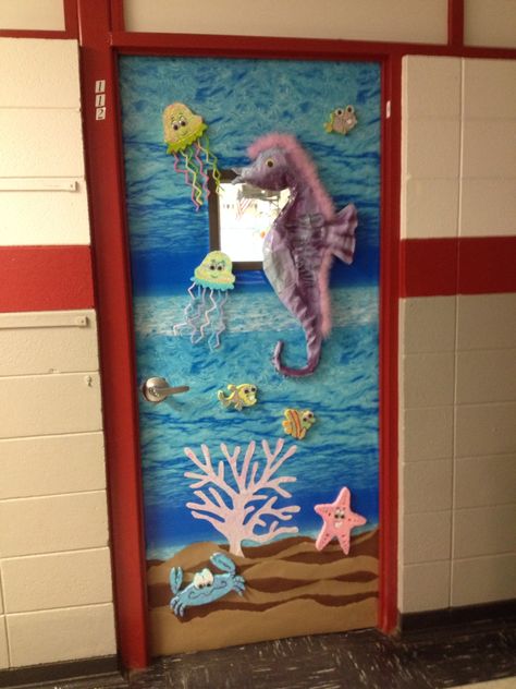 Classroom Art door. Seahorse, jellyfish, crab, starfish, ocean theme Starfish Door Decorations Classroom, Jellyfish Door Decoration, Mermaid Classroom Door, Mermaid Classroom, Turtle Classroom, Paper Palm Tree, Nautical Classroom, Ocean Classroom, Ocean Theme Classroom