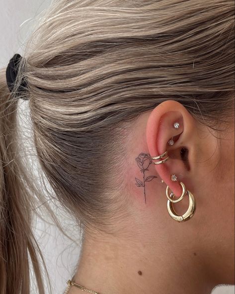 Small rose tattoo, behind the ear tattoos Fine Line Rose Tattoo Behind Ear, Small Red Rose Tattoo Behind Ear, Red Ink Rose Tattoo Behind Ear, Minimal Tattoo Behind Ear, Cute Tattoo Behind Ear, Dainty Rose Tattoo Behind Ear, Behind The Tattoos Ear, Behind Ear Fine Line Tattoo, Cute Behind Ear Tattoo