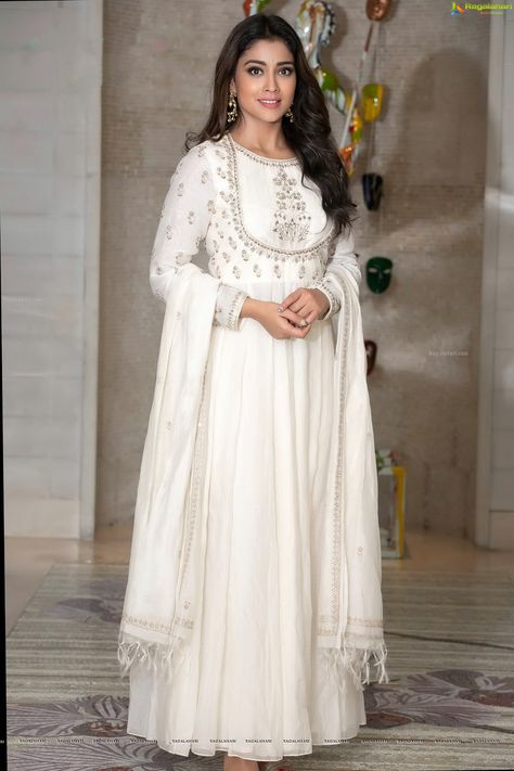 Shriya Saran Photos in White Anarkali Dress HD Gallery, Images White Anarkali Suits Classy, White Anarkali Dress, White Anarkali Suits, Off White Anarkali, White Anarkali, Long Gown Design, Beautiful White Dresses, Anarkali Dress Pattern, Calendar 2019