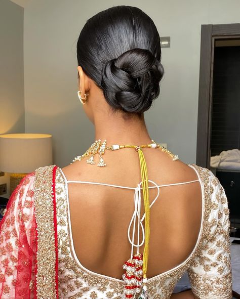 One of my favessss!! 🥨 Loved how elegant and sleek this was to go with the whole look for Shree’s wedding day Bridal makeup @_beautybyami Outfit @frontierraasuk Jewellery @thejewellerytrunk_ #weddinghair #wedding #bridalhair #bride #weddingdress #weddingmakeup #weddingphotography #weddingday #weddinginspiration #hair #bridalmakeup #updo #hairstylist #makeup #hairstyle #hairstyles #bridetobe #makeupartist #bridal #bridesmaids #weddings #love #weddinghairstyle #weddinghairstyles #weddingp... Indian Wedding Hair Updo, Indian Wedding Updo, Indian Bride Updo, Indian Wedding Hairstyles Buns, Updo Indian Wedding, Punjabi Bride Hairstyle, Desi Bride Hairstyles, Indian Bridal Updo, Desi Bride Hair