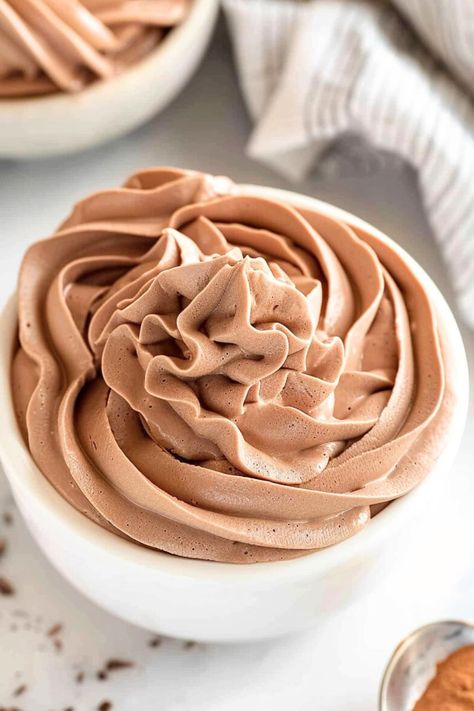 This foolproof chocolate whipped cream is light, airy, creamy, and packed with chocolate flavor. It's perfect for frosting cakes and cupcakes or topping hot chocolate and ice cream. Flavored Whip Cream, Whipped Chocolate Cream Cheese Frosting, Mocha Whipped Cream Frosting, Chocolate Wiped Cream Frosting, Stable Chocolate Whipped Cream Frosting, Chocolate Whipped Cream Frosting, Stablized Whipped Cream, Chocolate Whipped Cream, Recipes With Whipping Cream