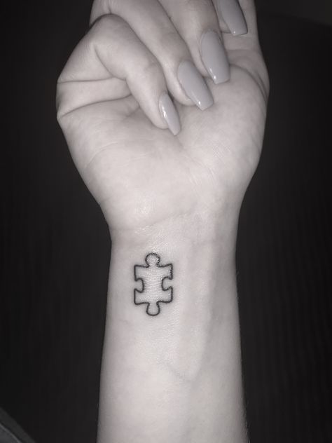 puzzle piece tattoo on wrist Minimalist Puzzle Piece Tattoo, Tattoo Ideas Puzzle Pieces, Small Puzzle Piece Tattoo Simple, Puzzle Pieces Tattoo Design, Tiny Puzzle Piece Tattoo, Puzzle Piece Butterfly Tattoo, Jigsaw Piece Tattoo, Puzzle Tattoo Design, Tattoo Puzzle Piece