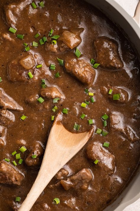 So incredibly delicious and easy to make, this beef tips and gravy recipe is rich and comforting. All cooked in one pot, the beef is tender and simmered in flavorful gravy. Serve over potatoes, rice or pasta for a delicious meal everyone will love. Beef Tips And Gravy Recipe, Grilled Beef Ribs, 40 Aprons, Canning Refried Beans, Beef Tips And Gravy, Iron Recipes, Vegetarian Tacos, Roast Beef Recipes, Beef And Potatoes