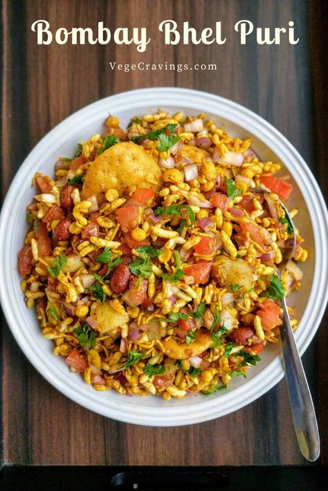 Bhel Puri is a popular Indian snack made with puffed rice, vegetables like boiled potatoes, tomatoes & onions, flavored with tangy chutneys. Bhel Puri Recipe, Chats Recipe, Potatoes Tomatoes, Puri Recipe, Indian Veg Recipes, Veg Snacks, Puri Recipes, Spicy Snacks Recipes, Breakfast Recipes Indian