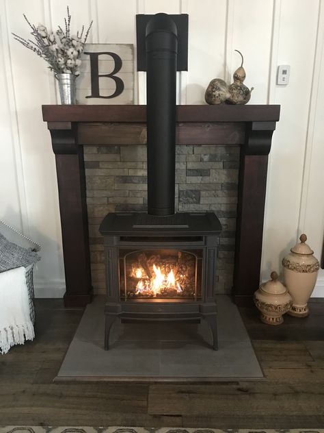 Wood Burning Stove Update, Mantel For Pellet Stove, Wood Stove In Family Room, Farmhouse Wood Stove Surround, Wall Behind Wood Burning Stove, Decorating Around A Wood Stove, Pellet Stove With Stone Wall, Mantle With Wood Stove, Raised Wood Stove Hearth