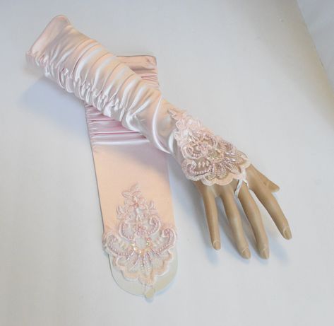 "Beautiful Formal Gloves Pink Fingerless Gloves with Beaded Lace Rouched Stretchy satin / polyester blended fabric One size fit most (S-XL) Regular women's size DESCRIPTION: These are gorgeous gloves done in all satin with embroidery, beads and sequins. They are rouched at the ends (upper arm portion). There is a loop that goes around the middle finger. MEASUREMENTS: ONE SIZE/Misses Regular Color: Pink Material: satin / polyester blended fabric + Lace Size: 14\" inches Pink Satin Gloves w/ Beads Pink Satin Gloves, Aesthetic Gloves, Pink Fingerless Gloves, Princess Gloves, Gloves Aesthetic, Fancy Gloves, Satin Gloves, Saloon Girls, Embroidery Beads