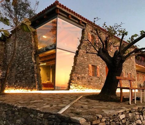 They repolished the wooden structures that were composed of aged stone and combine them with new glass. Modern Glass House, Glass House Design, Stone Exterior Houses, Stone Walls Interior, Old Stone Houses, Modern Renovation, Stone Architecture, Rustic Stone, Wooden Design