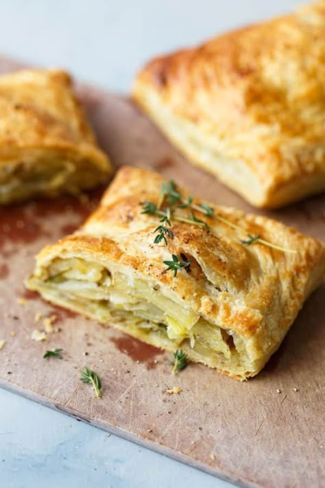 Potato Leek Cornish Pastry - a delicious classic English pastry made easy with store-bought puff pastry. The potato leek filling is combined with fresh thyme, sharp cheddar cheese, and cream to create a comforting, indulgent, and delicious main course! #leek #potato #pastry #thyme #pasty #abeautifulplate Cornish Pastry, Cornish Pasty, Pasties Recipes, Cornish Pasties, Creamed Leeks, Potato Leek, Savoury Pies, Simple Green Salad, Frozen Puff Pastry