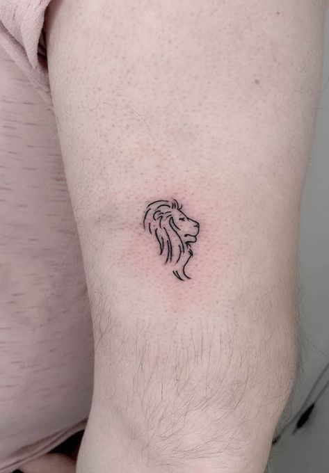 62 Fierce and Beautiful Lion Tattoos For Women Lions Head Tattoo For Women, Elegant Lion Tattoo, Lion Dainty Tattoo, Small Leo Lion Tattoo, Lion Stick And Poke, Outline Of A Lion Tattoo, Singapore Tattoo Minimalist, Small Simple Lion Tattoo, Lion And Bird Tattoo