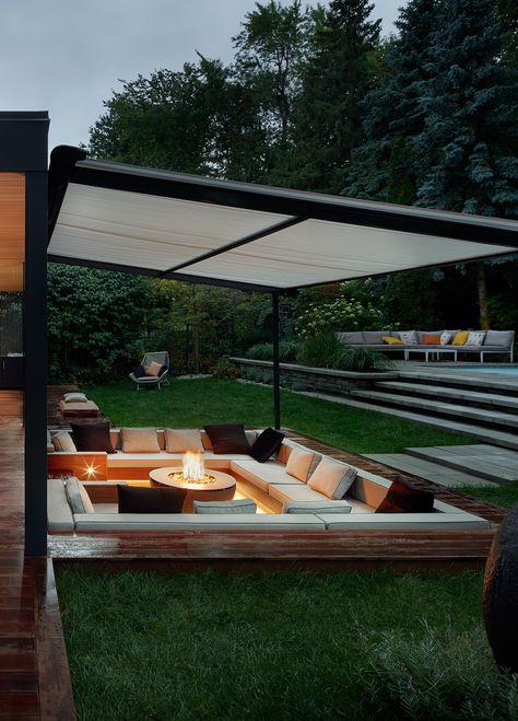 A Covered Outdoor Conversation Pit With A Fire Bowl Creates A Cozy Place To Relax At Night Outside Conversation Pit, Covered Fire Pit Area, Outdoor Conversation Pit, Hamptons Backyard, Sunken Patio, Sunken Fire Pits, Conversation Pit, Sunken Living Room, Wood Patio