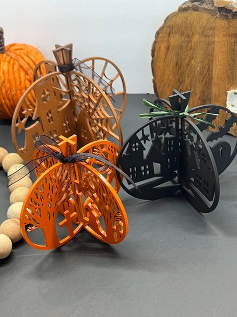 The centerpiece boasts intricate spooky trees, swooping bats, and a haunting graveyard scene. Whether as a bewitching table centerpiece or a haunting mantel display, our Laser-Cut 3D Pumpkin Laser Cut Christmas Tree, Laser Cut Halloween, Decorative Pumpkins, Laser Cut Christmas, 3d Pumpkin, Fall Table Centerpieces, Laser Cut Wood Earrings, Laser Cut Wood Crafts, Spooky Trees