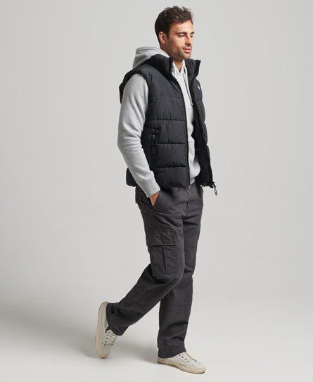 Achieve your goals in style this season. Whether you just want something to keep you warm or something to keep your arms free for an active lifestyle, the Sports Puffer Gilet can deliver on both. Relaxed fit – the classic Superdry fit. Not too slim, not too loose, just right. Go for your normal size Zip fastening Two front zip pockets Bungee cord adjustable hem Fleece lining Recycled padding Internal mesh pocket Embroidered Code logo on ches Embroidered Superdry logo on back of neck Durable wate Sleeveless Puffer Jacket Outfit Men, Sleeveless Puffer Jacket Outfit, Puffer Vest Outfit Men, Puffy Vest Outfit, Sleevless Jacket, Puffer Jacket Outfit Men, Man Fits, Gilet Outfit, Vest Outfits Men