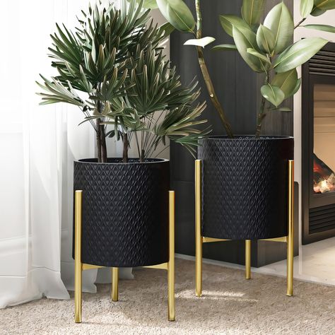 PRICES MAY VARY. A geometric diamond-shaped pattern offers a stylish look to the planter pots, while the gold stands give it a luxury contemporary vibe. Each gold stand is sturdy and will securely hold metal cachepots while the stand foot pad designs protect floor to prevent any scratches or scuffs. Crafted from durable iron, all metal cachepot planter set includes 1 large cachepot, 1 small cachepot, and 2 gold stands. Decorative planter set: these metal planter pots have no drainage holes; leav Gold Planter, Black Planters, Geometric Diamond Pattern, Modern Plant Stand, Metal Plant Stand, Floor Plants, Tall Planters, Luxury Contemporary, Modern Planters