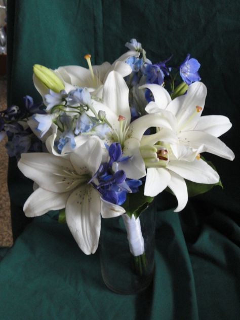 White lilies with blue delphinium Day Lily Bouquet, Blue Stargazer Lily Bouquet, Bouquet Wedding Lilies, Blue Lillie’s, Lily Prom Bouquet, Blue Lily Bouquet, Blue Stargazer Lily, White Lilies Bouquet, Blue Delphinium Bouquet