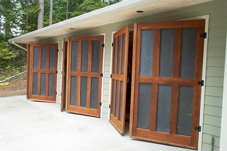 8 Garage Door Alternatives That Offer Style & Functionality | Worst Room Barn Door Garage, Small Garage Door, Shop Garage Doors, Exterior Garage Door, Door Alternatives, Double Garage Door, Carriage House Doors, Carriage Garage Doors, Diy Garage Storage Cabinets