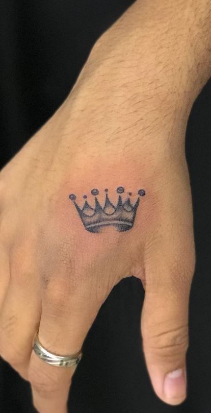 Hand Crown Tattoo, Male Crown Tattoo, Heavy Is The Head That Wears The Crown Tattoo, Crown Chest Tattoo Men, Small Crown Tattoo Men, Small King Crown Tattoo, Crown Tattoo On Shoulder, Men’s Small Tattoos Wrist, Small Tats For Men