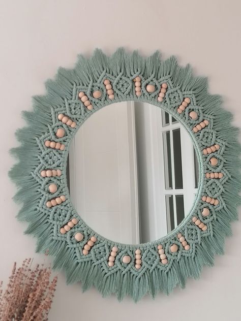 Our Green beaded mirror can complement the bohemian style of your home or be a good start for your soft style. Our handmade macramé mirror is perfect for adding a natural feel to your home decor. A perfect gift for yourself and your loved ones. You will feel bohemian style on every wall. Bedroom, hall, children's room will be a unique piece for all your rooms. All products are handmade, Therefore that may be a difference of 1 - 3 cm in size. Size; ▪️ 85 cm whole diameter ( 60 cm diameter ) Mirror Nursery, Macrame Decor Ideas, Macrame Circle, Simpul Makrame, Macrame Mandala, Beaded Mirror, Macrame Mirror, Macrame Supplies, Macrame Wall Hanging Patterns