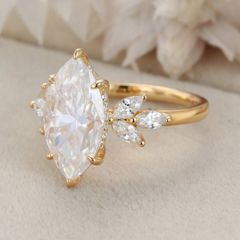 Experience vintage glamour with our Unique 3 Carat Marquise Cut Moissanite Engagement Ring, crafted in 14K Yellow Gold. This timeless piece exudes elegance and sophistication, making it the perfect symbol of everlasting love. Marquis Engagement Ring With Gold Band, Engagement Rings Heirloom, Marquise Leaf Ring, Pear Shaped Engagement Rings Vintage, Classy Engagement Ring Marquise, Chunky Marquise Ring, Vintage Gold Marquise Engagement Ring, Yellow Stone Engagement Rings, Custom Marquise Engagement Ring