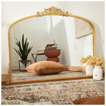 Full Dimensions: 33" H x 44" W x 1.38" D Mirror Dimensions: 28" H x 38" W Material: Metal & Glass Shape: Crowned Top Color: Gold Orientation: Horizontal Includes: 1 Keyhole Mount Care & Safety: Do Not Hang With Wire Quantity: 1 Enhance your space's French country charm using our Gold Bordeaux Wide Arch Metal Wall Mirror. This beautiful accent mirror has an MDF backing and a windowpane shape with a metal frame. The metal is accentuated with slight distressing and ornate scroll pattern embellishments. Display this lovely mirror in your living room behind your mantel or in your bedroom behind your backboard!