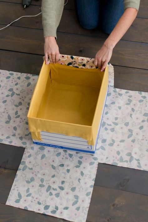 How to Make DIY Fabric-Wrapped Storage Bins | HGTV Carton Diy, Fabric Covered Boxes, Diy Storage Boxes, Fabric Storage Boxes, Fabric Storage Bins, Fabric Boxes, Diy Cardboard, Diy Interior, Fabric Baskets