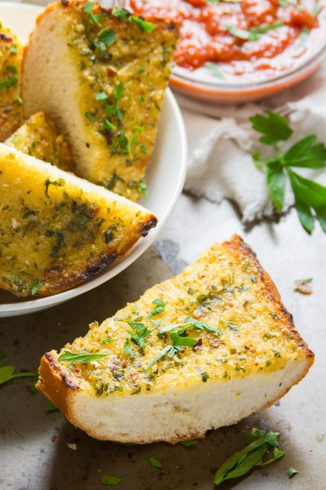 The best garlic bread you’ve ever tasted, and it just happens to be vegan! The trick: whip up mellow roasted garlic and olive oil to create a creamy, flavor-packed emulsion, slather it on crusty Italian bread, then toast to crispy perfection. This delicious diary-free garlic bread is a must-have side dish for your next pasta dinner. #veganrecipes #garlicbread #italianfood #roastedgarlic #dairyfree Savory Quick Bread, Bread With Olive Oil, Vegan Garlic Bread, Bread Roast, Vegan Bbq Recipes, Vegan Breads, Bbq Recipes Grill, Homemade Garlic Bread, Garlic Garlic