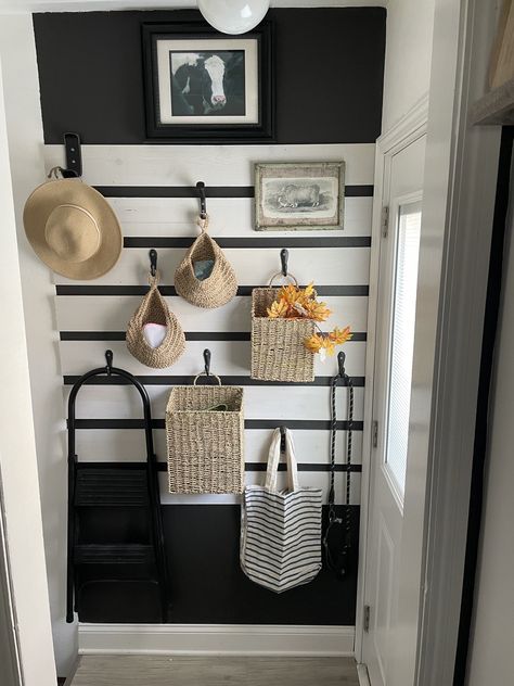 I used Menards 1 box shiplap, Hobby Lobby wrought iron hooks, Amazon wall baskets and black wall paint to define this narrow storage space behind my back door😁 Space Behind Front Door Entryway, Behind The Front Door Ideas, Behind Door Wall Decor, Wall Behind Front Door, Behind Front Door Decor, Behind Door Decor, Behind Door Entryway, Hooks Behind Door, Space Behind Door