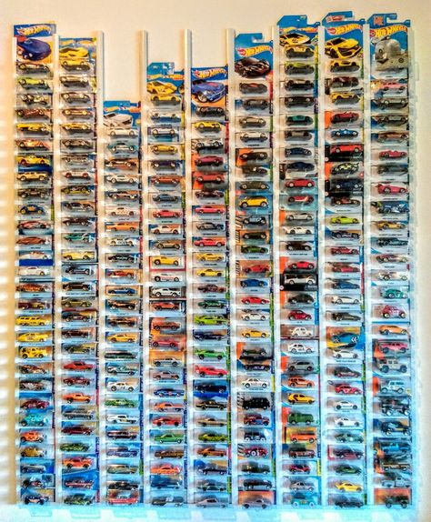 My current Hot Wheels (in original packaging) collection October 2019 - on the wall of my study using plastic roof battons (as shown on YouTube). Each row has a different category. From left; Hot Rods & Dragsters - Chevrolet - Buick & Olds & Pontiac & Caddie - Ford & Shelby - Mopar & AMC - British - European - Japanese - Random (4X4 Tooned, Famous Cinematic) ... Hot Wheels Storage Ideas In Package, Hot Wheels Display In Package, Hot Wheel Car Display Ideas, Hot Wheel Collection Wall, Hot Wheel Displays, Hot Wheels Storage Ideas Diy, Hot Wheel Wall Display, Hot Wheels Collection Display, Hot Wheels Wall Storage