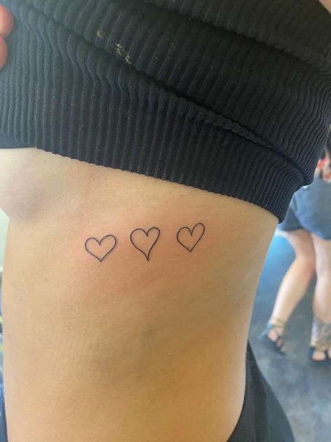 Heart On Ribcage Tattoo, Family Hearts Tattoo On Ribs, Simple Tattoos Ribcage, Heart On Ribs Tattoo, Hearts On Ribs Tattoo, Family Draws Hearts Tattoo, Heart Tattoo Ribcage, Small Tattoos Ribs, Family Hearts Tattoo