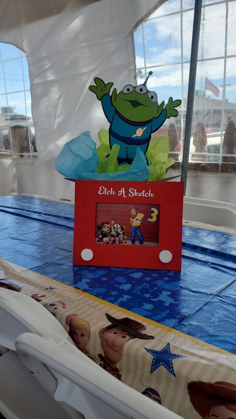 Toy Story 2nd Birthday Centerpieces, Toy Story Etch A Sketch Frame, Pixar Centerpieces, Toys Story Centerpieces, Toy Story Gumball Centerpiece, Toy Story Table Decorations Centerpieces, Toy Story Cake Table Ideas, Toy Story Birthday Table Centerpieces, Toy Story Birthday Centerpieces Diy