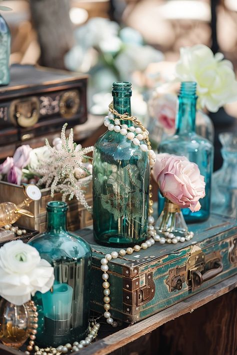 Dive into matrimonial bliss with our unique collection of nautical-themed wedding centerpieces. Think treasure chests filled with shimmering accents and bottles that whisk you away to the ocean's edge 🌊💍 Create a magical and adventurous tablescape that will enchant your guests. #WeddingInspiration #NauticalWedding #WeddingCenterpieces #TreasureDecor #BeachWeddingIdeas #RomanticWedding #UniqueWedding #TableDecor Pirate Theme Wedding Ideas, Pirate Themed Wedding Decor, One Piece Themed Wedding, Nautical Floral Arrangements, Aquatic Wedding Theme, Pirates Of The Caribbean Wedding Theme, Ocean Themed Wedding Decorations, Treasure Chest Centerpiece, Pirates Of The Caribbean Wedding