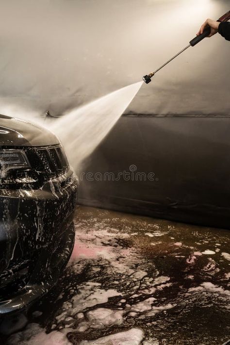 Cleaning the car body with a high pressure water jet at a self serve car wash. Washing the foam from the surface of the stock photo Self Serve, Car Body, Surface Cleaner, Water Jet, Car Cleaning, Car Wash, High Pressure, Vector Art, Photo Image