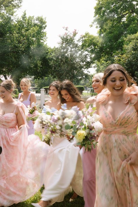 Garden party theme bridesmaid dresses and candid Austin wedding photography moment Whimsical Wedding Bridesmaids Dresses, Garden Party Wedding Photos, Colorful Wedding Photos, Whimsical Wedding Photos, Formal Garden Party Wedding, Whimsical Bridesmaid Dresses, Whimsical Bridesmaids Dresses, Wedding Ideas Colorful, Whimsical Engagement Photos