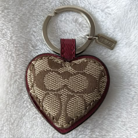 Nwot Coach Signature Heart Keyring / Bag Charm. Features Signature Canvas Trimmed In Burgundy Leather. Approximate Measurements Not Including Keyring 1 3/4"(W) X 1 1/2"(H). Beautiful Keyring! Coach Bag Charms, Purse Decor, Mini Duffle Bag, Purse Collection, Holiday Wishlist, Leather Lanyard, Pretty Aesthetic, Shoe Nails, Backpack Keychains