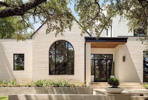 Step into this beautiful Austin home hidden amongst majestic live oaks Transitional Architecture, Design Publication, Austin Homes, Casa Exterior, Luxe Interiors, Texas Homes, Arched Windows, Interiors Design, Stone Work