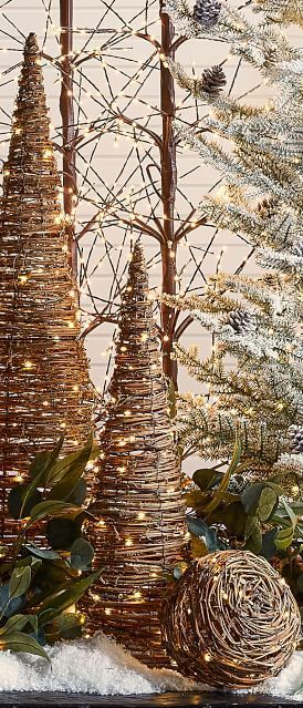 An easy rustic holiday update that’s oh-so-enchanting, the twinkling Light Up Grapevine Cone Tree is woven with natural rattan around a sturdy frame for years of awe and wonder. #rusticchristmas Cabin Ornaments, Grapevine Tree, Rustic Christmas Decorations, Grapevine Christmas, Tomato Cage Christmas Tree, Holiday Planter, Fall Arts And Crafts, Christmas Wreaths Diy Easy, Cone Trees