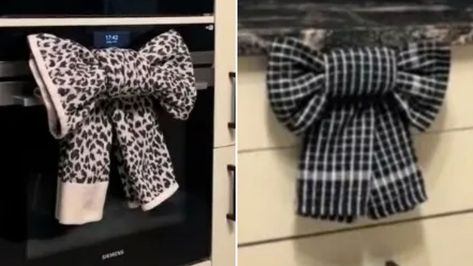 Woman shows clever way she turns her tea towels into pretty bows for Christmas Bow Towel Fold, Kitchen Towel Bow Fold, Kitchen Towels Hanging Ideas On Stove, Hand Towel Bow Fold, Christmas Towel Folding, Dish Towel Bow, Tea Towel Folding, Tea Towel Folding Gift Ideas, Kitchen Towel Folding Ideas