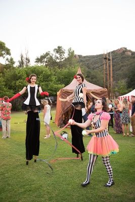 Circus Entertainment at Wedding    Photography: Lucy Munoz Photography   Read More:  http://www.insideweddings.com/weddings/cj-perry-and-miroslav-barnyashev/961/ Circus Theme Wedding, Alternative Wedding Reception, Fun Wedding Entertainment, Circus Wedding Theme, Circus Entertainment, Wedding Entertainment Ideas, Stilt Walker, Engagement Party Games, Cj Perry