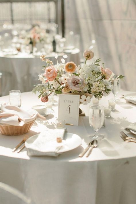 Romantic wedding tablescape featuring elegant table number cards & centerpieces in pastel hues | Midwest wedding, Omaha wedding planning, Nebraska wedding planner, luxury wedding planner, wedding inspo, wedding ideas, wedding reception decor, summer wedidng inspo, wedding tablescapes, wedding table decor, wedding table setting, wedding table centerpieces, wedidng menu, wedding stationery, wedding linens, modern romantic wedding, outdoor wedding, pink wedding theme, wedding details, dinner ideas Wedding Table Centerpieces Summer, Wedding Table Flowers And Candles, Blush Pink Wedding Table Decor, Summer Wedding Floral Centerpieces, Wedding Table Settings Round Tables, Wedding Table Circle, Wedding Table Decor Round Tables, Modern Romantic Wedding Decor, Wedding Table Setting Ideas Elegant