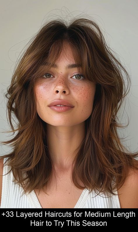 Discover stylish medium length haircuts! Explore elegant shoulder waves, chic mid-length layers, and sophisticated layered styles perfect for refreshing your look. #medium #length #haircut Layered With Bangs Shoulder Length, Choppy Layers With Bangs Medium, Medium Length Shaggy Hair, Middle Haircut With Bangs, 70s Hair Medium Length, Shaggy Mid Length Hair With Bangs, Mid Hair Bangs, Medium Layered Haircuts For Thick Hair Mid Length With Bangs, Medium Length Hair With Long Bangs