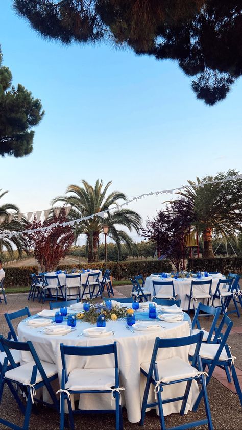 Round, white & blue tables. Mamma mia inspo. Greece. Mama Mia Hoco Theme, Greece Themed Birthday Party, Mama Mia Centerpieces, Mama Mia Prom Theme, Mamma Mia Birthday Party Aesthetic, Mamma Mia Aesthetic Birthday, Mamma Mia Picnic, Mamma Mia Garden Party, Mamma Mia Prom Theme