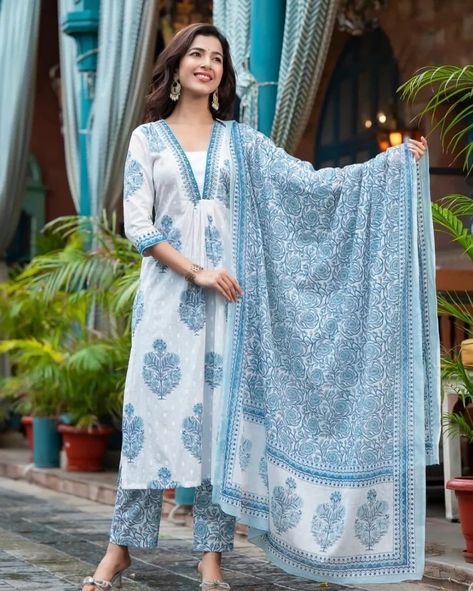 Exquisitely crafted, the Kalina Blue Handwork Suit Set offers a luxurious experience - the perfect pick for any festive occasion. White buta print and embroidery make an eye-catching combination, while a floral jaal print dupatta exudes refined elegance Rendered in the finest cotton, this suit set will have you looking and feeling your absolute best. Fabric - Pure 60/60 Cotton with Cotton Dupatta and with Lining in Kurta Sizes : M/38 , L/40 , XL/42 and XXL/44 PRICE - 950/-+Ship Extra ... Jaipuri Suits, Cotton Suit Designs, Churidar Neck, Long Tunic Dress, Straight Cut Pants, Desi Fashion Casual, Cotton Kurti Designs, Cotton Dupatta, Stylish Pants