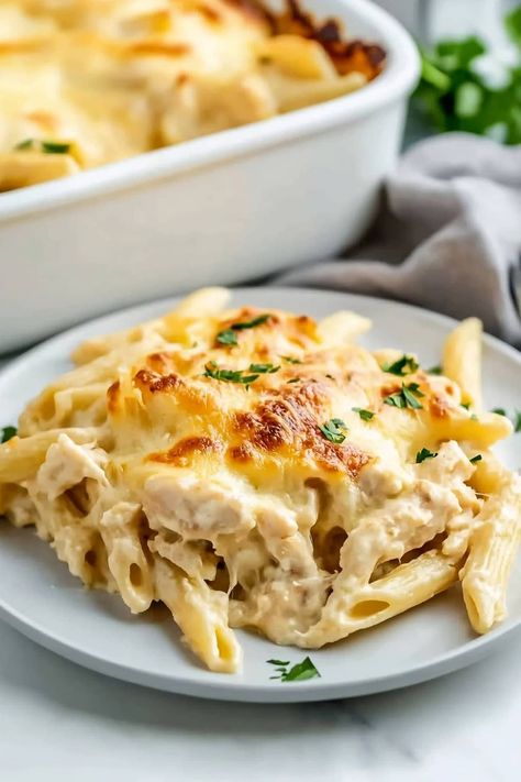 This Chicken Alfredo casserole is comforting, satisfying, and so delicious! And since it's a dump-and-go meal, it's easy to make, too! Alfredo Casserole, Chicken Alfredo Casserole, Chicken Alfredo Bake, Chicken Milk, Chicken Alfredo, Penne Pasta, Alfredo Sauce, So Delicious, Minced Garlic