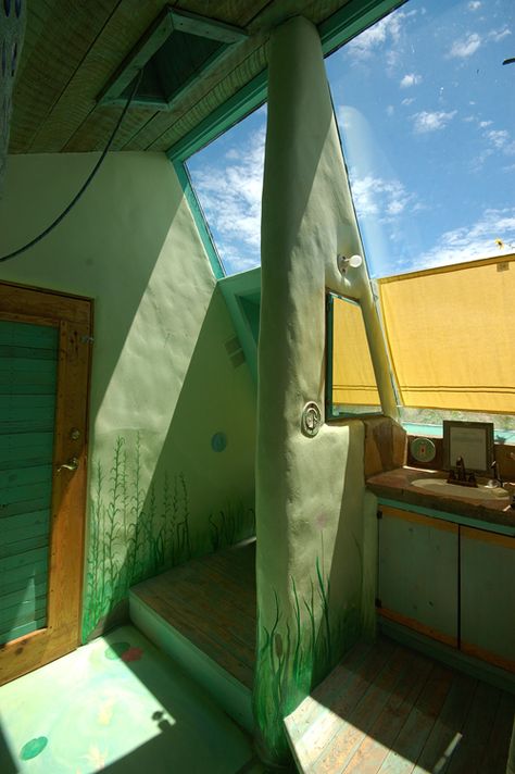 Earthship Interior | Inside the studio earthship at the Greater World Earthship Community ... Earthship Community, Earthship Interior, Earthship Biotecture, New Mexico Desert, Bathroom Stalls, Mexico Desert, Sustainable Housing, Unusual House, Alternative Housing