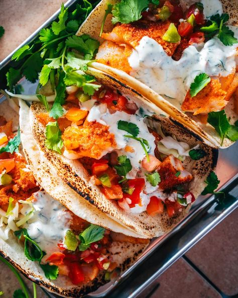 Creamy Taco Sauce, Cod Tacos, Cod Fish Tacos, Slaw For Fish Tacos, Grilled Cod, A Couple Cooks, Salmon Tacos, Cilantro Lime Sauce, Tilapia Recipes