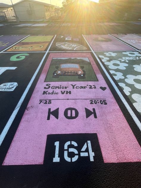 Parking Spot Painting Album Cover, Orange Senior Parking Spot, Parking Spot Inspiration, Parking Lot Senior Painting, Group Parking Spot Ideas, Spotify Senior Parking Spot, Parking Spot Painting High School Sports, Twin Senior Parking Spots, Duo Parking Spot Painting