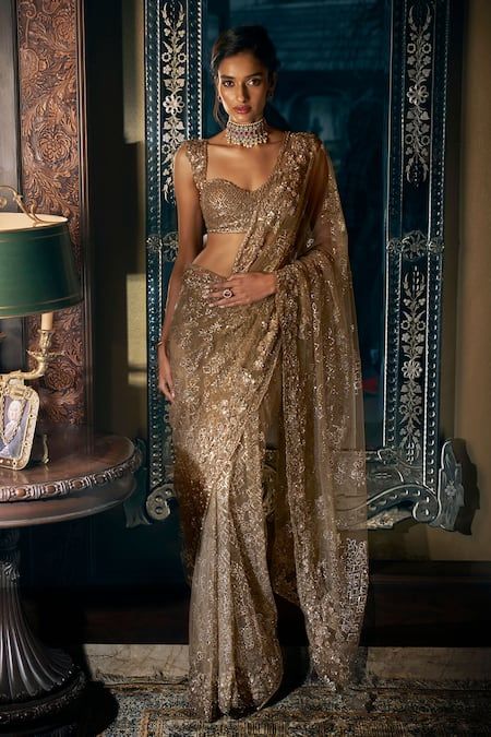 Buy Gold Net Embroidered Sequin Antique Tonal Saree With Blouse For Women by Seema Gujral Online at Aza Fashions.