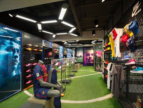 Ari Football flagship store Whitespace Bangkok 03 Football Store Display, Football Display Ideas, Football Interior Design, Sport Bar Design, Sports Training Facility, Football Displays, Batting Cage, Soccer Store, Football Shop