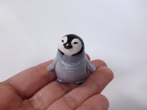 This figurine of baby penguin is completely handmade from a polymer clay. Then painted with acrylic paint and finished with glossy varnish. Size: 3,5 cm ( 1,3 inch) The figurine arrives in a gift handmade box. Please, dont use it as a toy for small children. More of unique gifts you Polymer Clay Small Figures, Clay Penguin Sculpture, Penguin Clay Art, Small Clay Animals, Tiny Clay Things, Penguin Habitat, Penguin Pottery, Polymer Clay Penguin, Penguin Ceramic