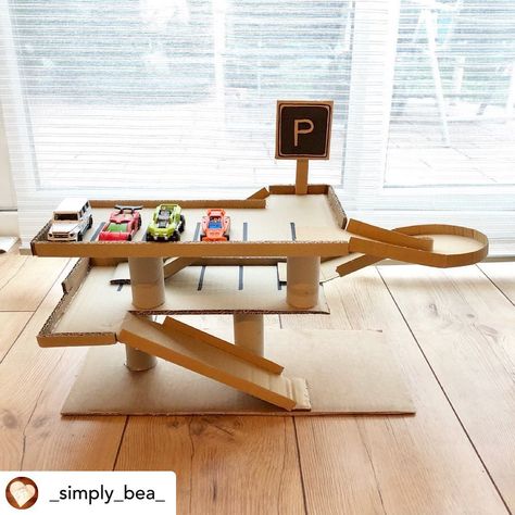 A Pop Of Culture on Instagram: “Posted @withrepost • @_simply_bea_ 🅿️Cardboard Car Park Garage🚘 . Our cardboard city is growing with the addition of our car park garage…” Diy Parking Garage For Kids Cars, Cardboard Builds, Cardboard Town, Diy Toys Car, Cardboard City, Diy Cardboard Toys, Toy Car Garage, Cardboard Castle, Cardboard Car